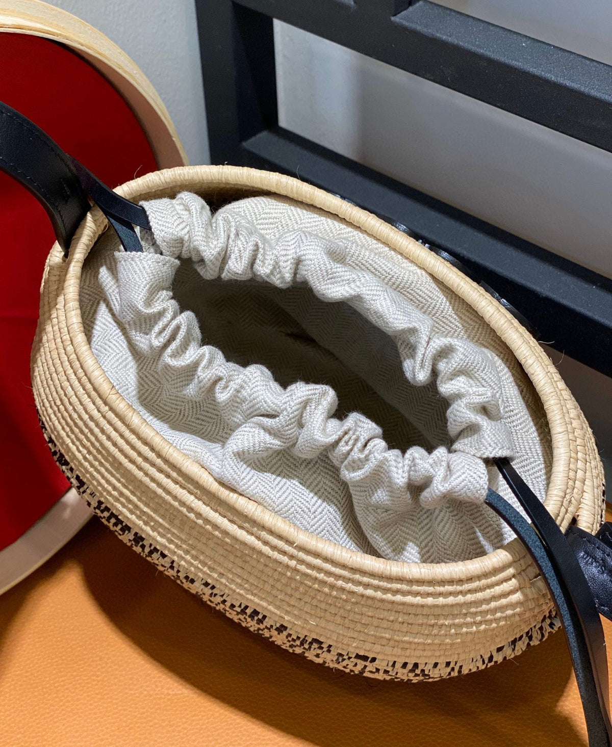 LOE 18 ANAGRAM BASKET BAG IN BLACK AND NATURAL RAFFIA