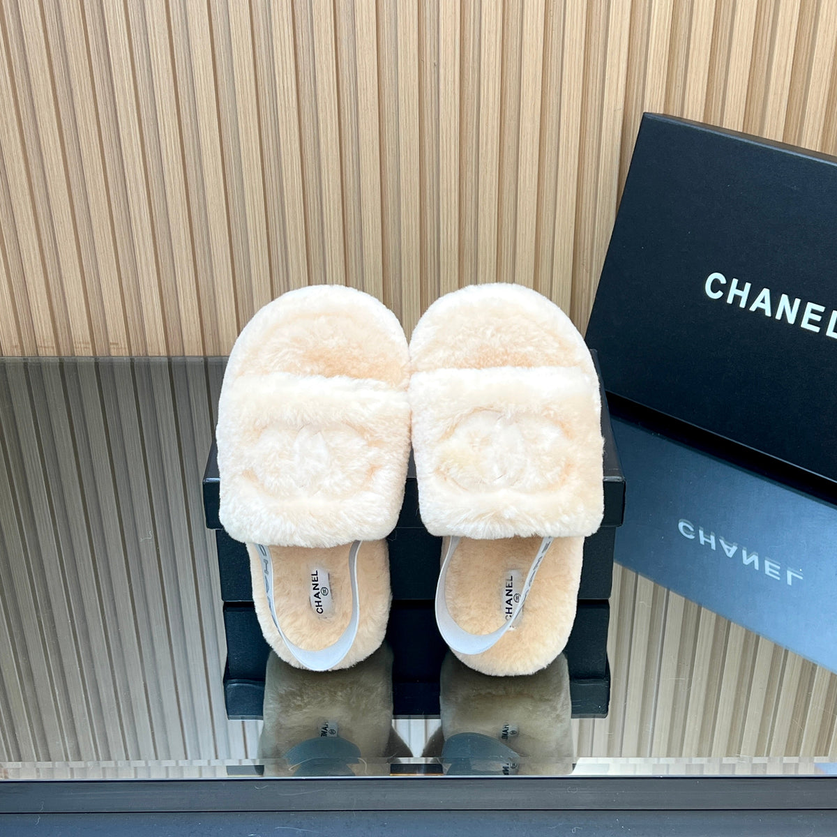 CHANEL 25S THICK-SOLED FURRY SLIPPERS WITH ELASTIC STRAPS IN BEIGE FUR