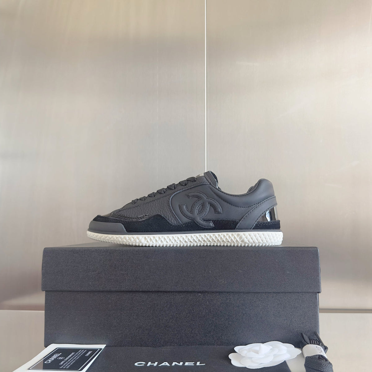 CHANEL 25S SNEAKERS WITH PATENT TOE 20MM IN BLACK CALFSKIN