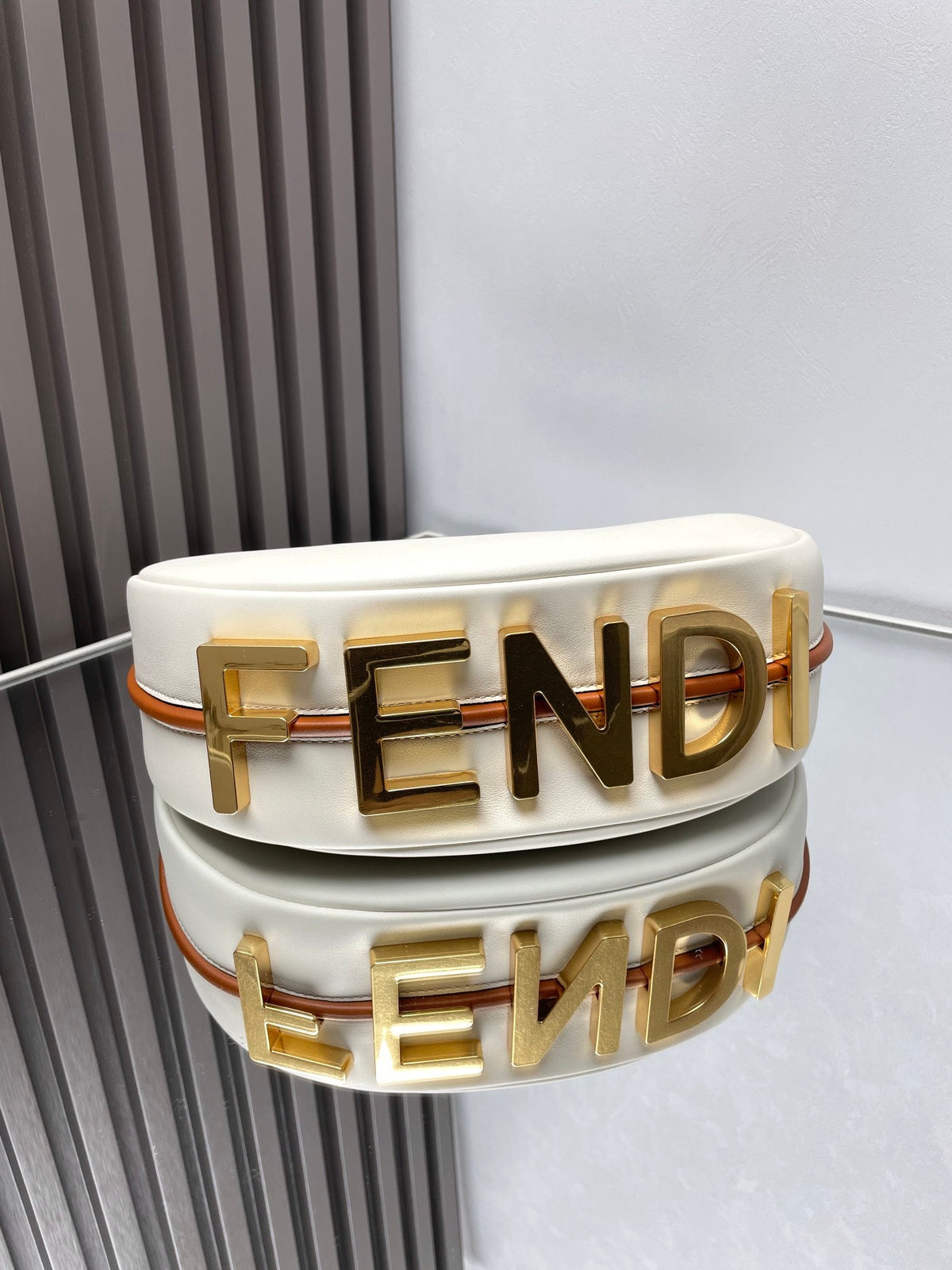 FENDIGRAPHY MEDIUM 29 IN WHITE AND ORANGE TRIM SMOOTH LAMBSKIN GOLD HARDWARE